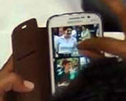 BJP MLA zooming Priyanka Gandhis picture during Karnataka Assembly